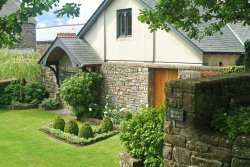 a view of the &quot;women's garden&quot; and entrance into the interpretive centre